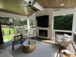 Rustic Covered Porch with Stone Fireplace in Charlotte, NC