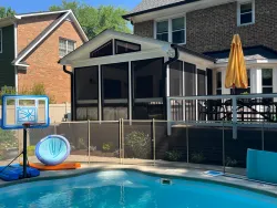 Luxurious Screened Porch with Cushioned Furniture