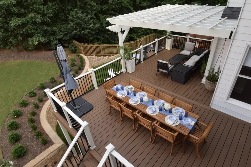 Spacious screened porch with vaulted ceiling, wooden flooring, and recessed lighting, offering a comfortable outdoor space with ample natural light.