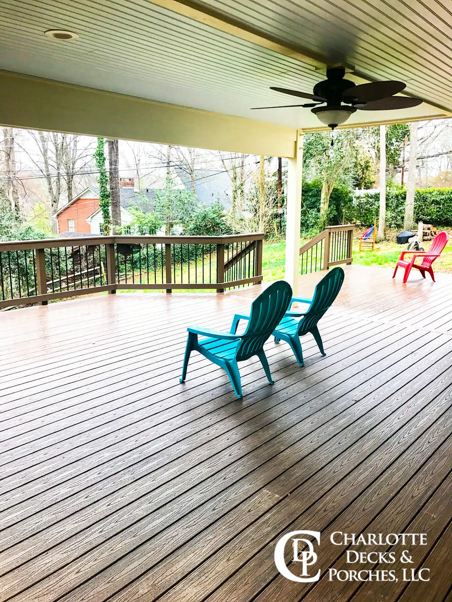 Composite Trex deck with a modern railing system, showcasing a spacious outdoor living area designed for durability and low maintenance.