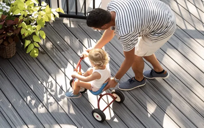 Beautiful Trex composite deck with sleek railings, showcasing durability and low-maintenance materials against a natural backdrop.